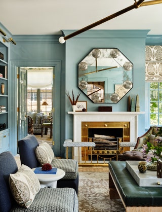 The family room of a Kansas City house by Henry  Co is painted in ‘Smoke by Benjamin Moore a versatile colour that can...