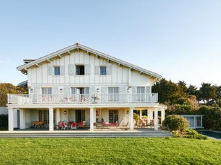 This typical halftimbered Basque baserri has been given a fresh contemporary look with woodwork painted in pale grey...