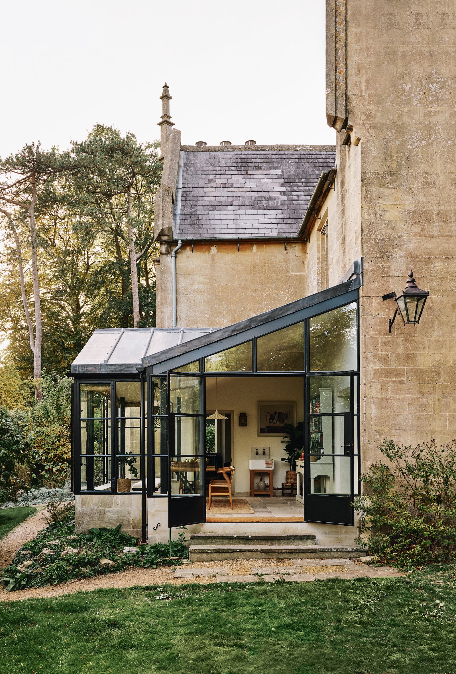 A conservatory attached to an old vicarage in Bath decorated by Anna Haines